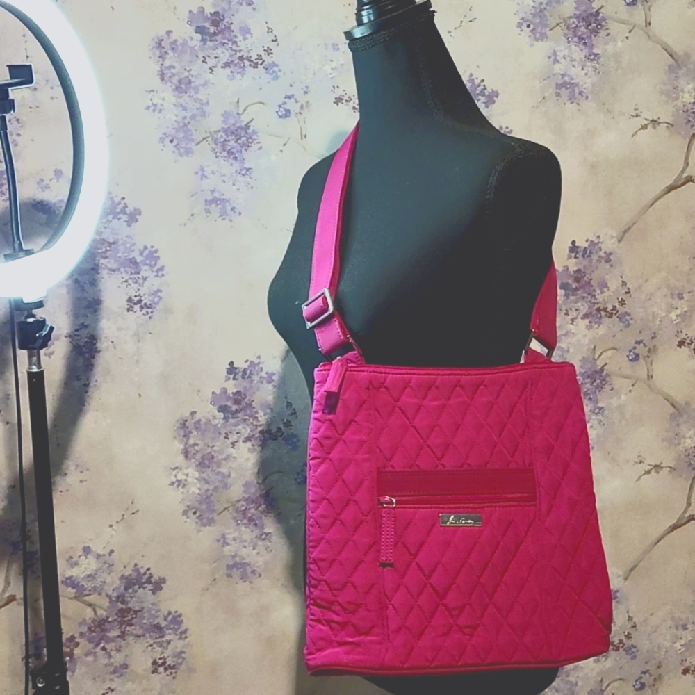 Magenta quilted Vera Bradley shoulder purse w/ floral print lining.